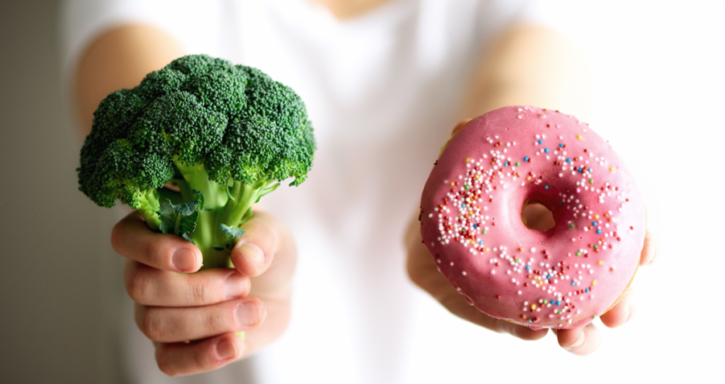Child choosing between broccoli and a doughnut, illustrating how processed food influences children taste preferences