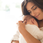 Mother cuddling her newborn baby during the first 1000 days of life