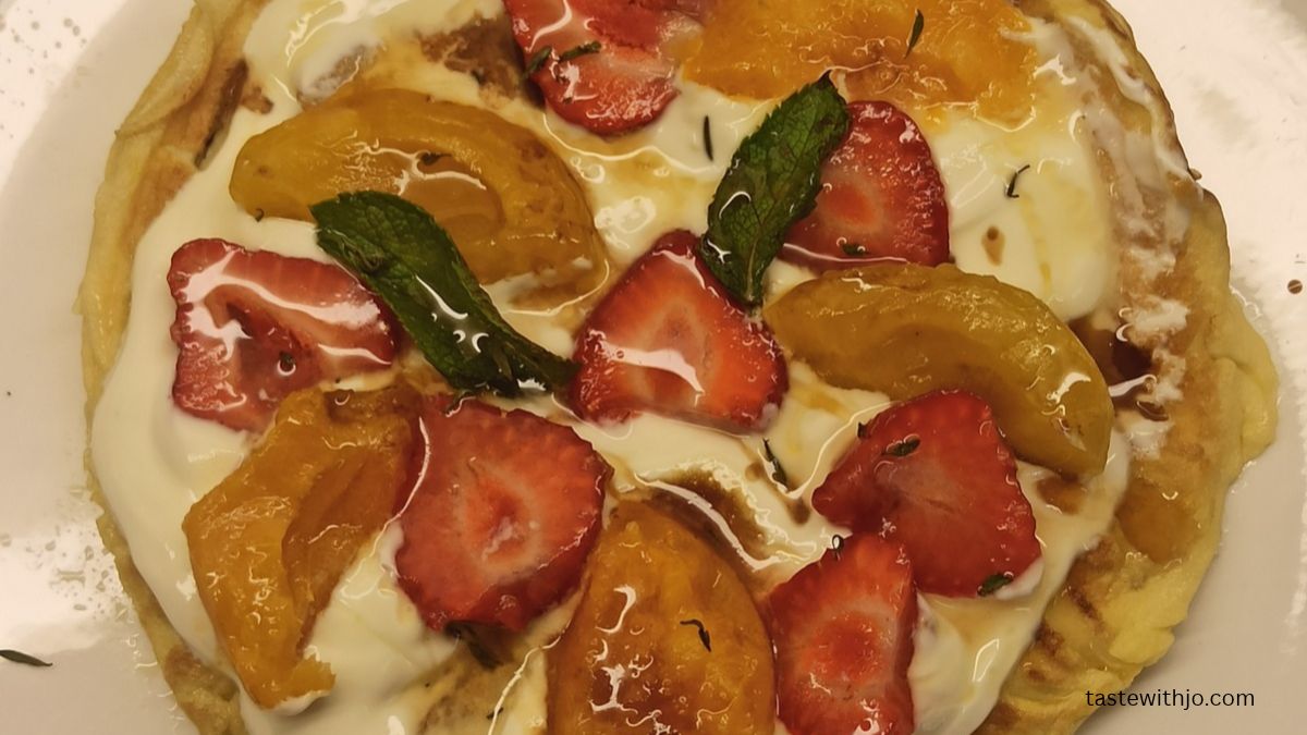 Sweet omelette topped with creamy vanilla quark, caramelised apricots, fresh strawberries, thyme and mint.