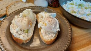 Polish twaróg and mackerel spread on sourdough toast with poached eggs